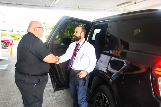 May be an image of 3 people, van, car and text